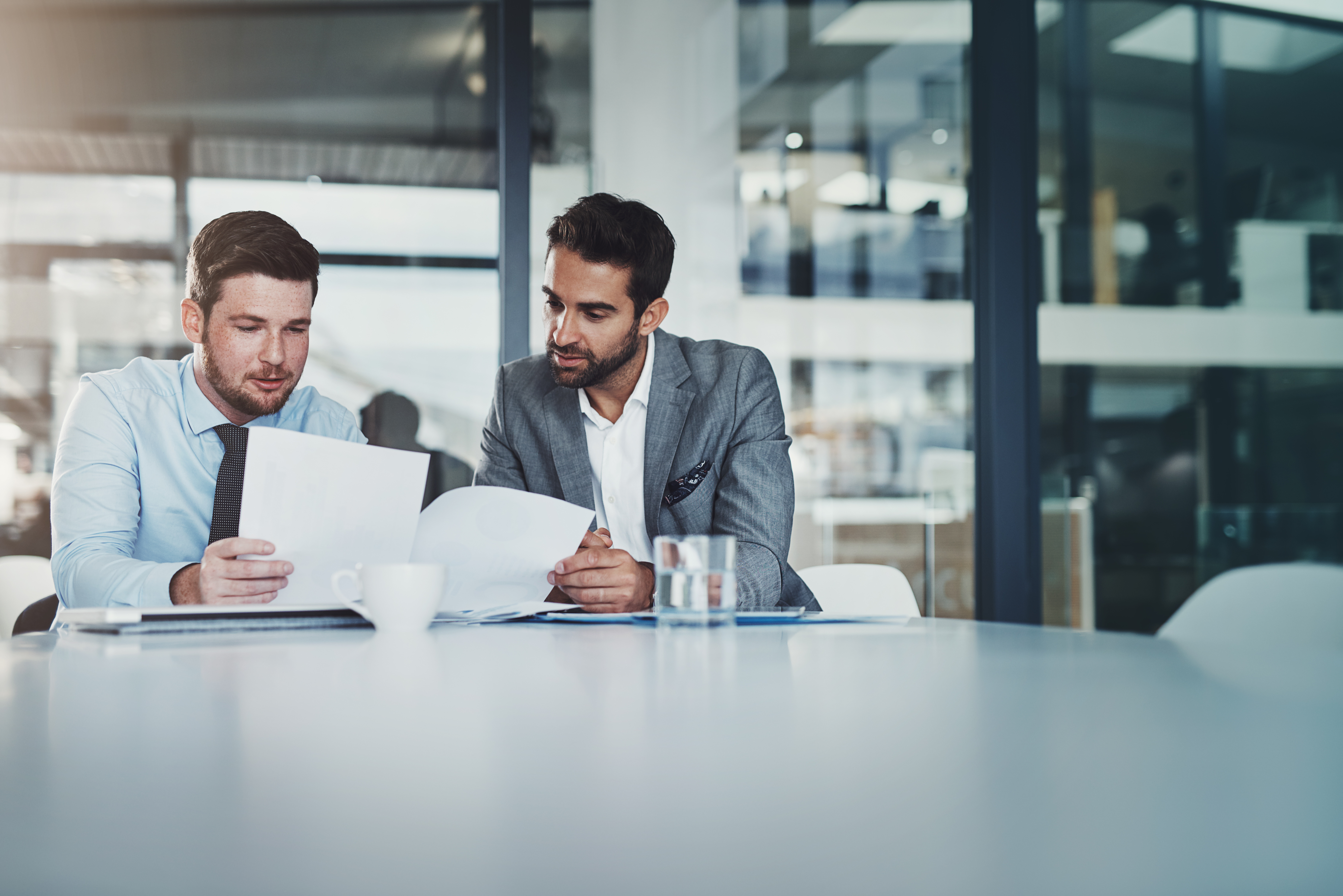 Two people discussing documents.